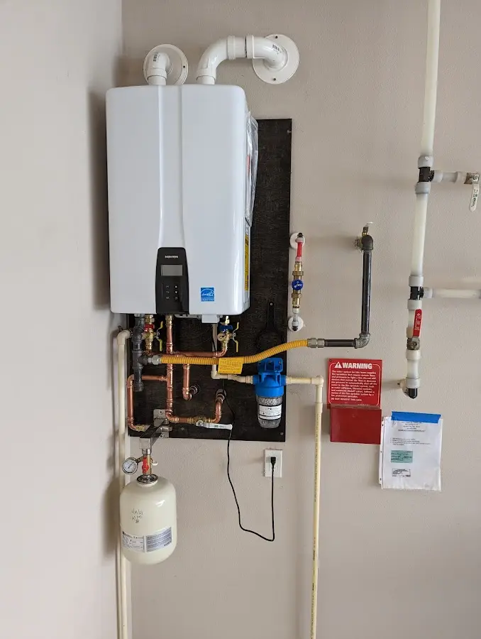 Professional plumber installing copper piping in a Happy Valley home